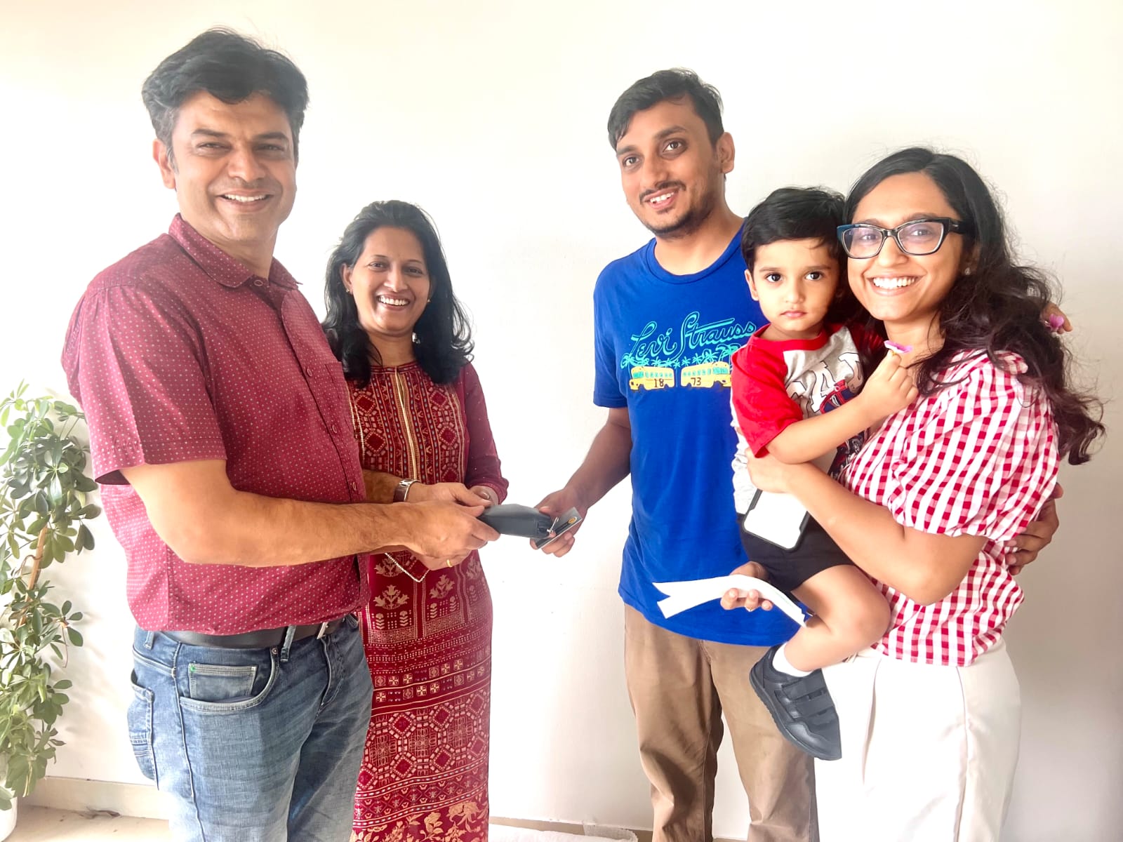 Happy customers celebrating a completed property handover